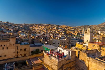 High angle view of townscape against blue sky