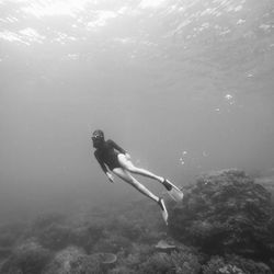 Woman swimming in sea