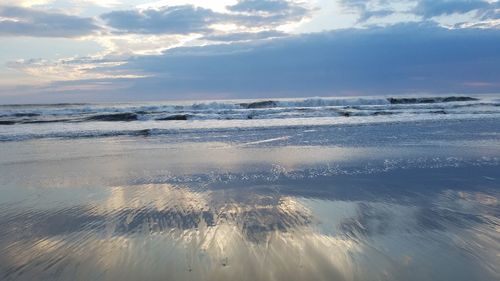 Scenic view of sea against sky at sunset