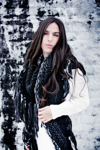 Portrait of young woman standing outdoors