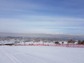 Ski slope in winter against sky