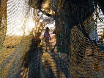 Shadow of people on fence