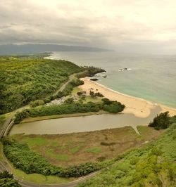 High angle view of bay against sky