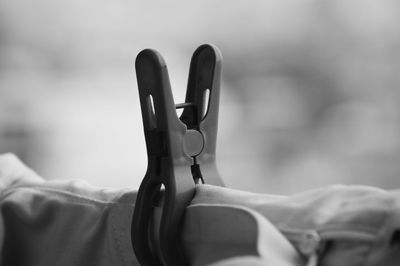 Close-up of clothespin on clothesline