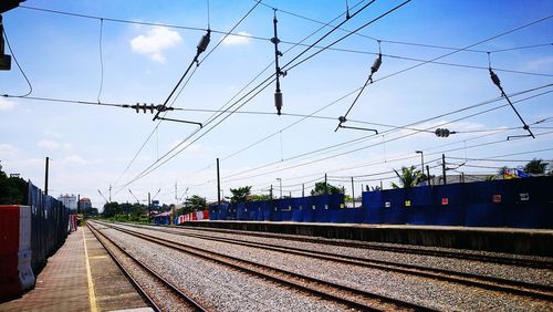 Train on railroad tracks against sky