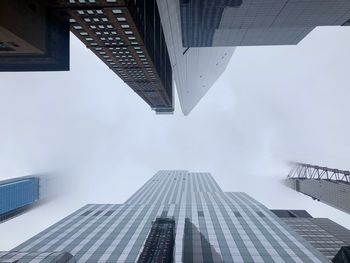 Directly below shot of modern buildings against sky