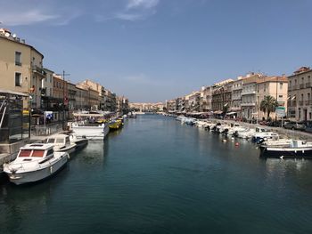 Boats moored at harbor