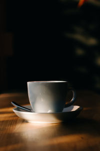 Close-up of coffee cup on table