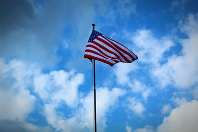 Low angle view of flag against sky