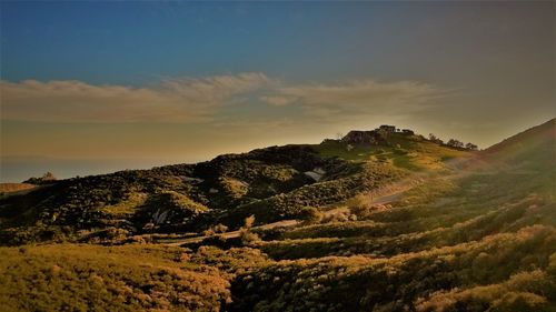 Scenic view of landscape against sky during sunset