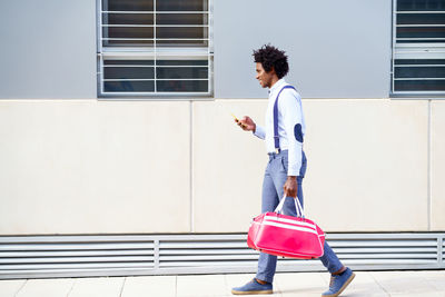 Side view of woman walking on street