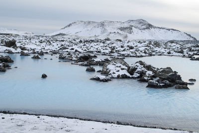 Scenic view of frozen lake against sky