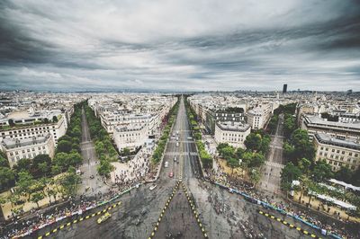 Cityscape against cloudy sky