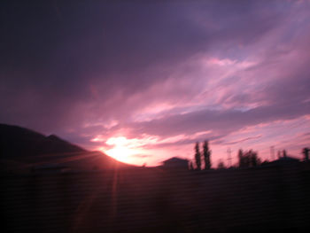 Scenic view of silhouette mountains against sky during sunset