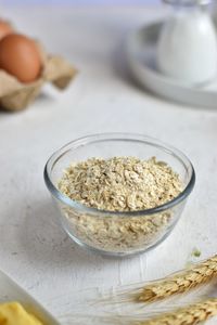 High angle view of wheat in clear bowl, on the table