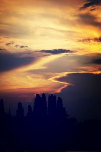 Silhouette of trees against sky during sunset