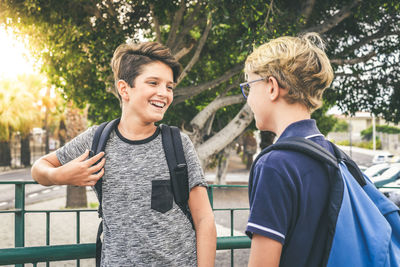 Portrait of smiling young man standing outdoors