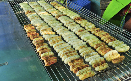 High angle view of meat on barbecue grill