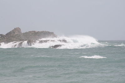 Waves splashing on rocks