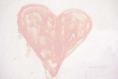 Close-up of heart shape over white background