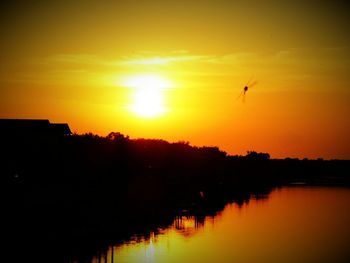 Scenic view of sunset over river