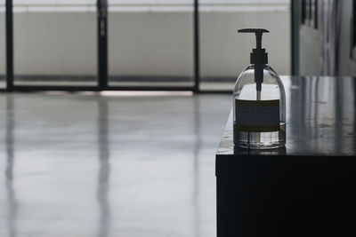 Close-up of glass bottle on table