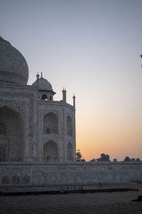 Low angle view of building against sky during sunset