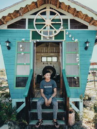 Portrait of smiling woman sitting outdoors