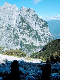 Low section of person on snowcapped mountain