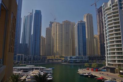 Modern buildings in city against sky