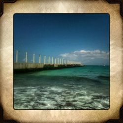 Scenic view of sea against blue sky