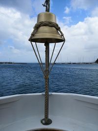 Lifeguard hut on sea against sky