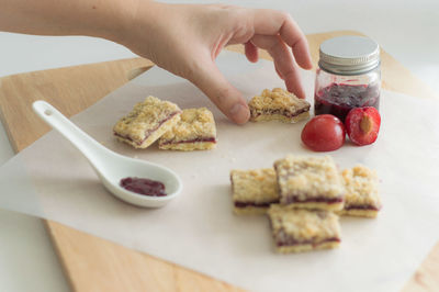 High angle view of person preparing food on cutting board