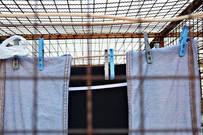 Low angle view of clothes drying against building