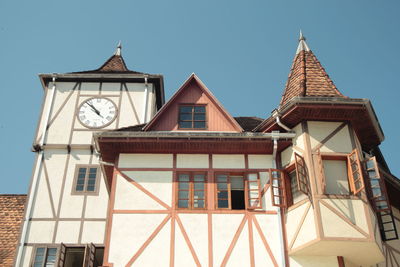 Low angle view of clock tower against sky