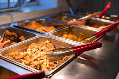 Pulled pork barbecue among other items at a buffet