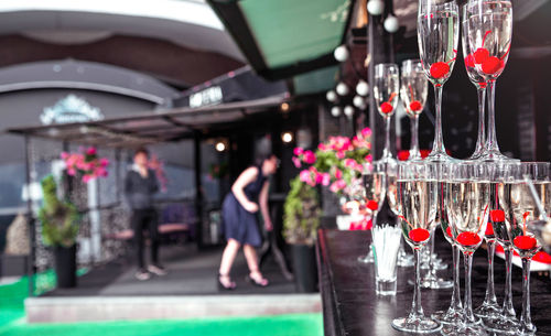 Midsection of woman with red wine in restaurant