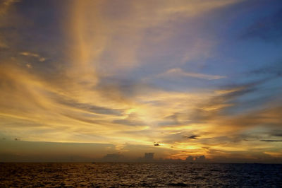 Scenic view of sea at sunset