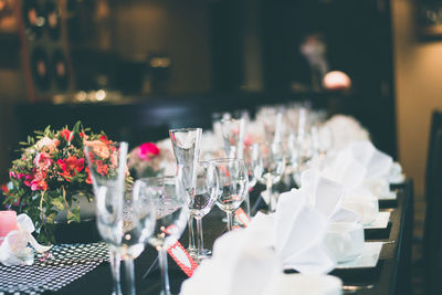 Close-up of wine glasses on dining table