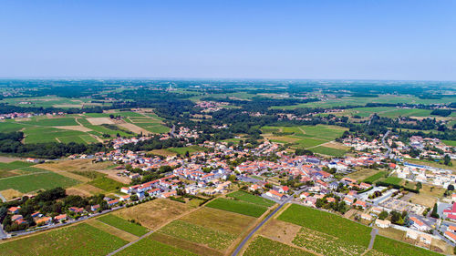 Aerial view of agricultural field against clear sky