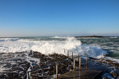 Scenic view of sea against clear sky