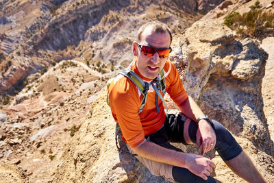 A portrait of a mountain biker on a break from a ride in colorado.