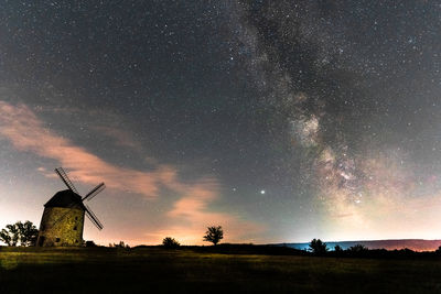 Scenic view of field against sky with milky way in the harz mountains 