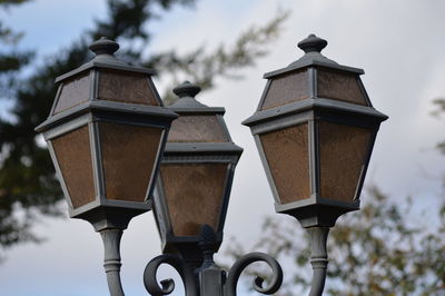 Low angle view of street light against sky