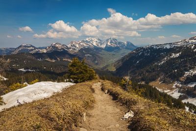 Scenic view of snowcapped mountains against sky