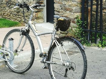 Bicycle parked against wall