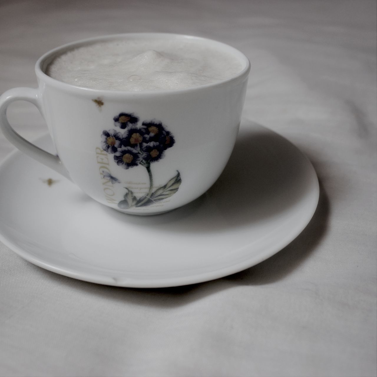 food and drink, indoors, table, freshness, still life, coffee cup, food, sweet food, drink, plate, refreshment, close-up, high angle view, dessert, coffee - drink, spoon, ready-to-eat, cup, indulgence, white color