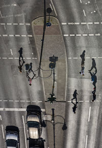 High angle view of people crossing road
