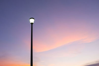 Low angle view of street light against sky