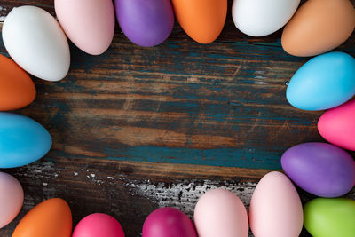 Low section of person with multi colored balloons